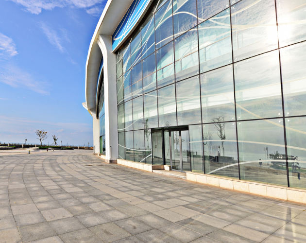 Modern commercial building with full glass facade installation